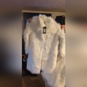 3 fur coats. 1 is shorter than the other 2 and 2 are the same.